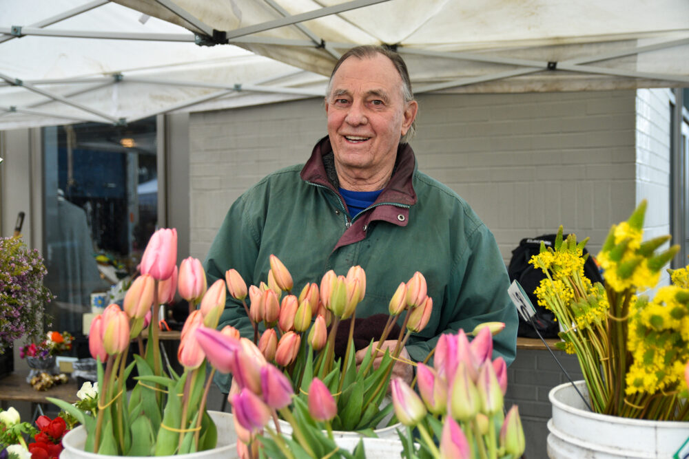 Farmer Randy at Cypress Flower Farm's Market stand at FPFM