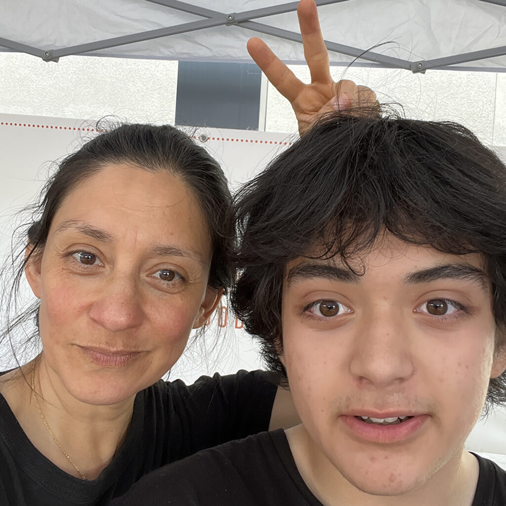 A selfie of two people at the farmers market